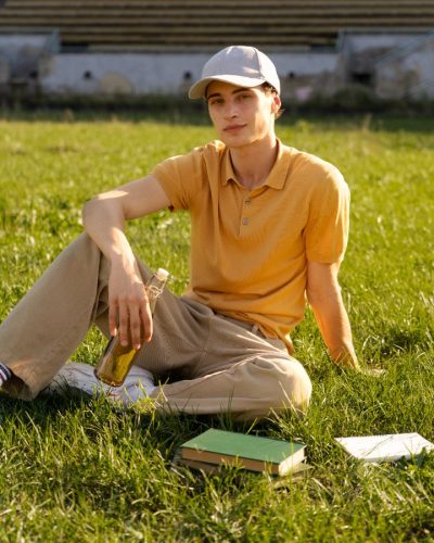 compressed_full-shot-young-man-sitting-grass